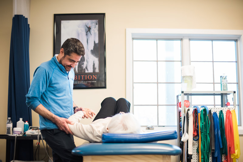 Manahawkin Physical Therapist, Jim Sellnow works with a patient to heal her shoulder