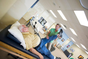 Physical Therapist in Manchester NJ stretching patient