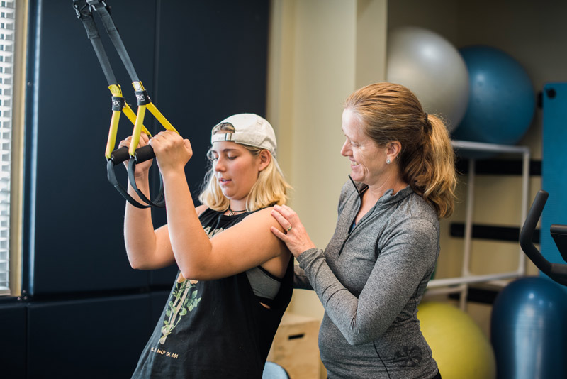 Physical Therapist, Sandy Neumann works with athlete