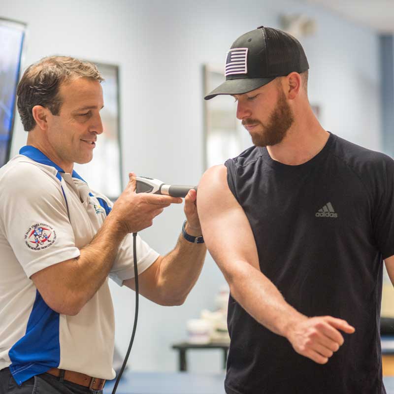 Physical Therapist, Mike Manzo performs EPAT on Cincinati Red's Pitcher Anthony DeSclafani